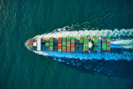 aerial-view-of-blue-and-white-boat-on-body-of-water-during-daytime.jpg aerial view of blue and white boat on body of water during daytime